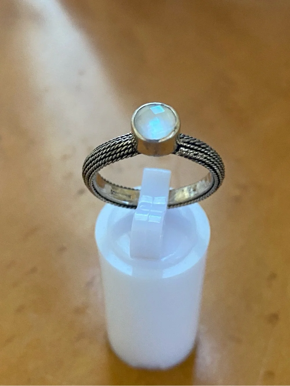 Sterling Silver Braided Band Ring with Reflective Faceted Stone